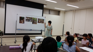 Volunteering at the Toyonaka Community Environment Center (豊中市立環境交流センター). We explored the topic of fair trade with kodomo (1st to 3rd grade children). Although the children spoke better Japanese than me, we still managed to have a fun time and somehow communication worked out! Although I wasn’t quite sure how to get this one Japanese girl to not climb on me. ~ Donald Swen