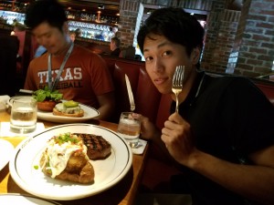 Restaurant with lab members. At the restaurant, I am eating a beef steak. That is very big and taste good! ~ Hiromi Miwa