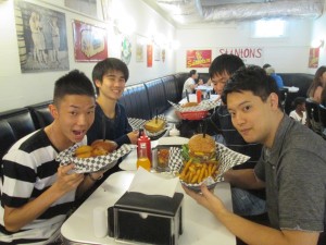 Eating the stereotypical American hamburger. ~ Soya Miyoshi