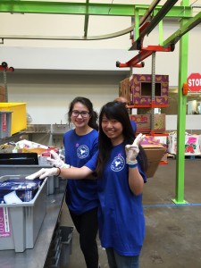 At the Houston Food Bank with another freshman student. ~ Yunong Wang 